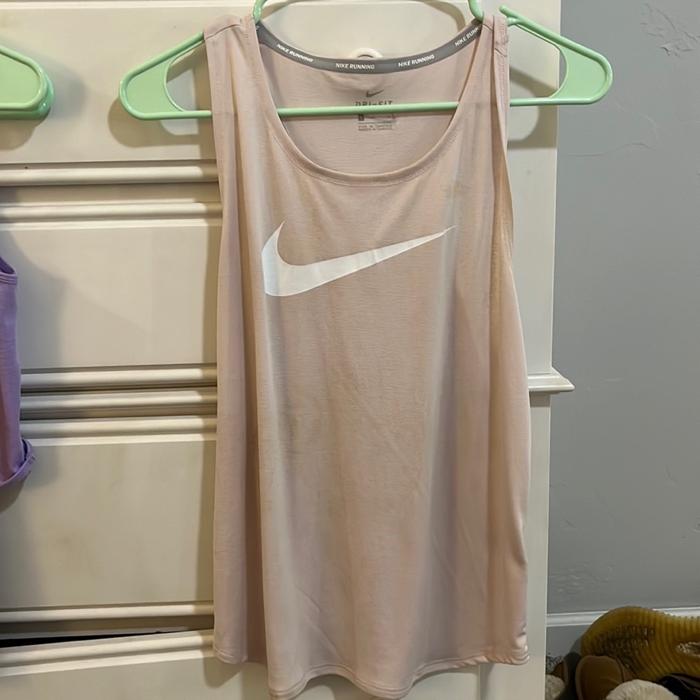 Light pink Nike tank top